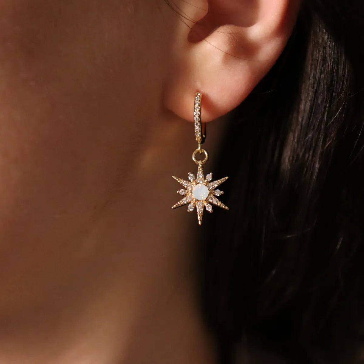 woman wearing star shaped jewel earring