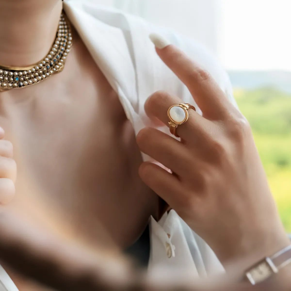 women wearing mother of pearl ring