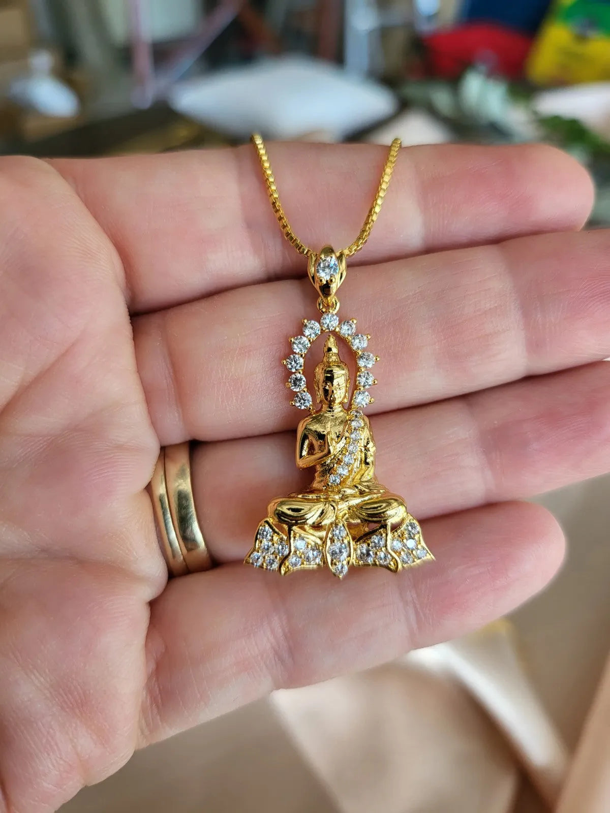 Gold Meditation Buddha Necklace product images.