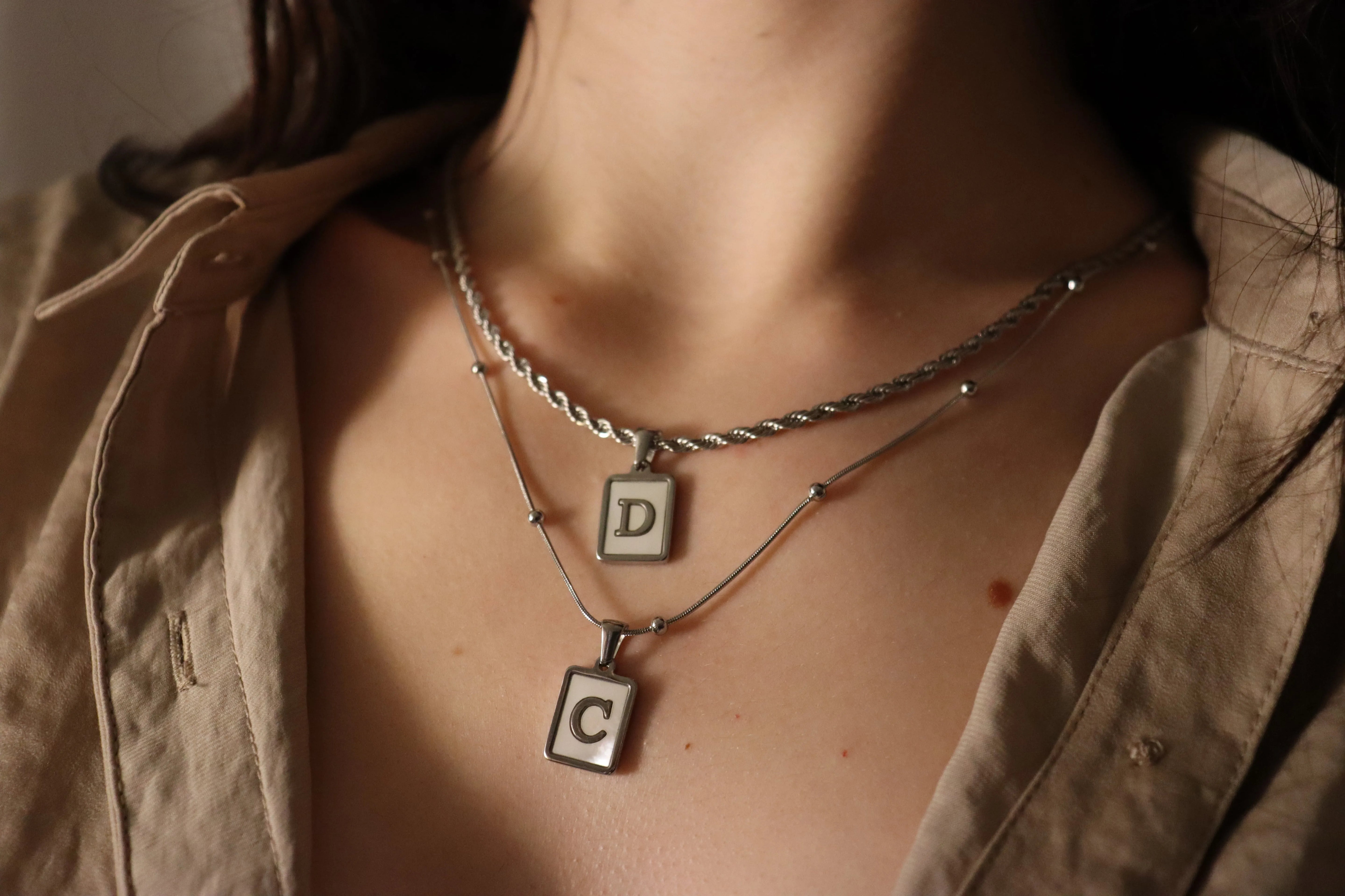 Silver Stainless Steel Mother Of Pearl Initial Necklace product images.